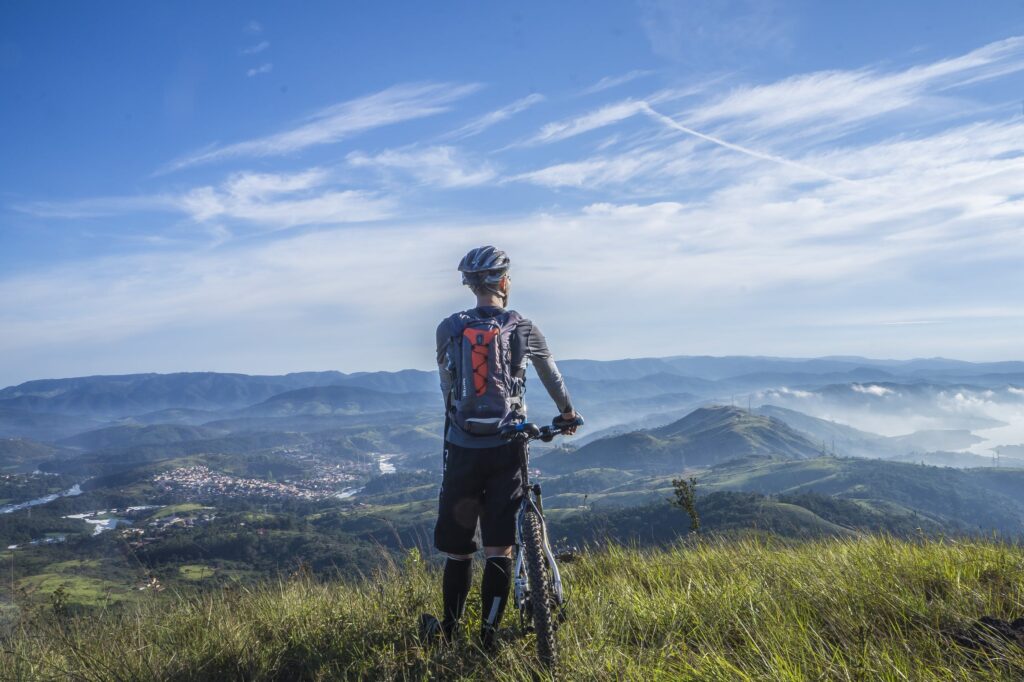 at the top of a steep hill after cycling